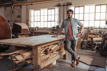 Young confident man in his woodworking shop