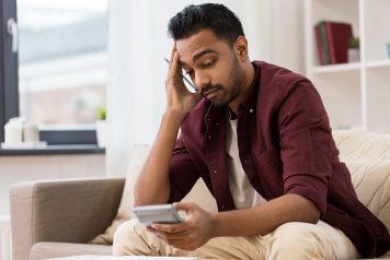 Man stressed about improving his credit score
