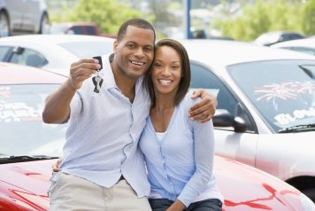 Couple buying a used car