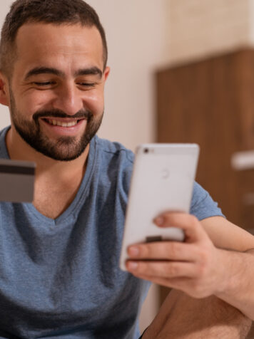 man with credit card and phone